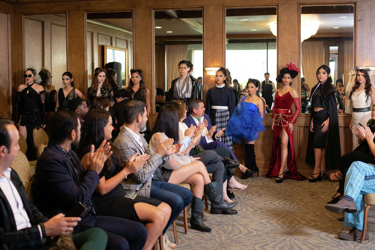 Guests applauding models at Laredo Country Club Friday, Aug. 19, 2022 for the Laredo Fashion Week Kick-Off Cocktail Event for the designers.