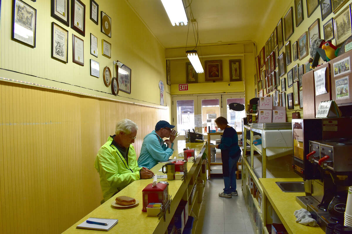 Regulars at Red's Donuts enjoy a little morning treat, some coffee and some companionship in downtown Monterey. The doughnut shop has been there since 1950.