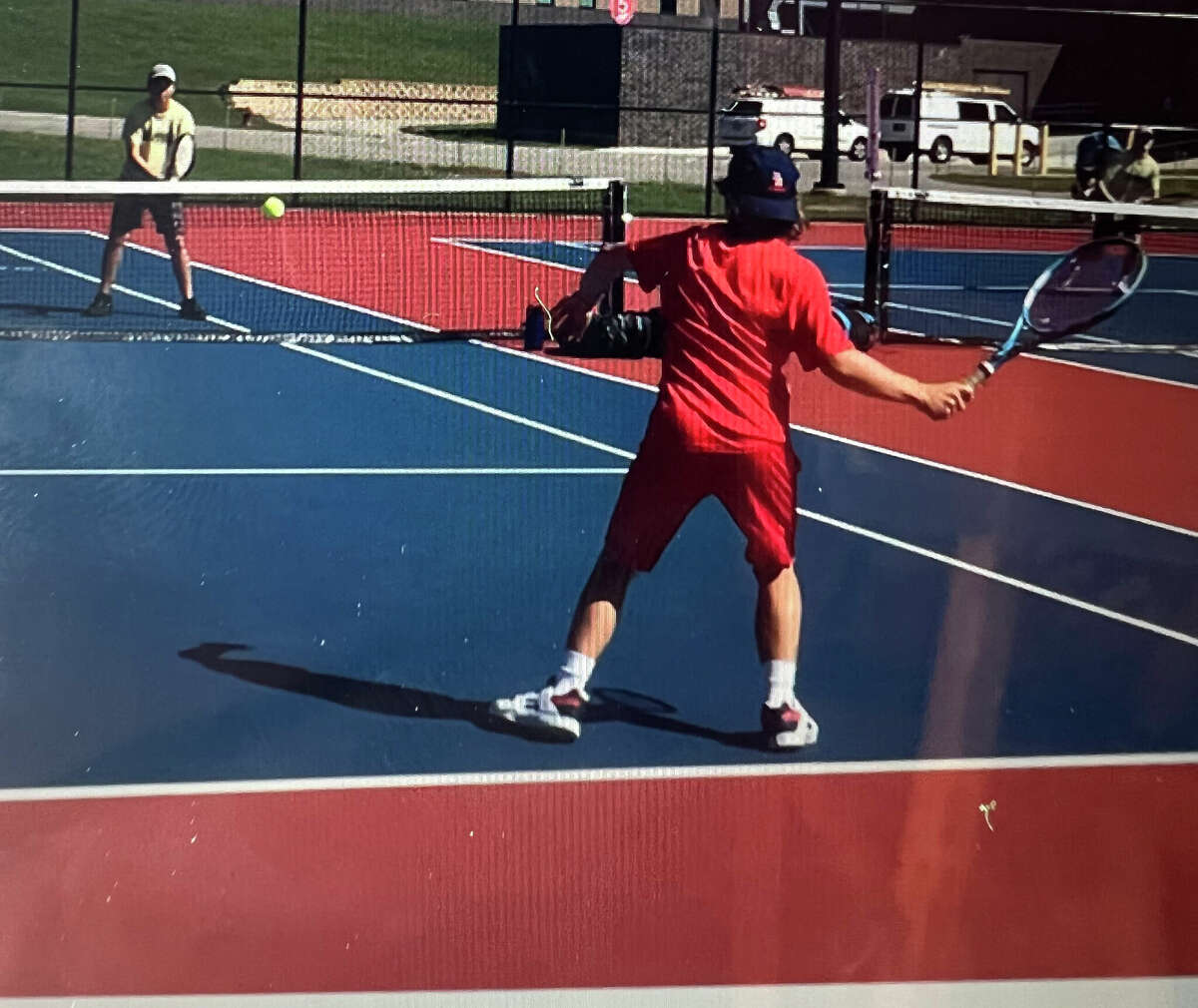 Isaac Zocco (right) returns the ball for Big Rapids on Monday in doubles action.