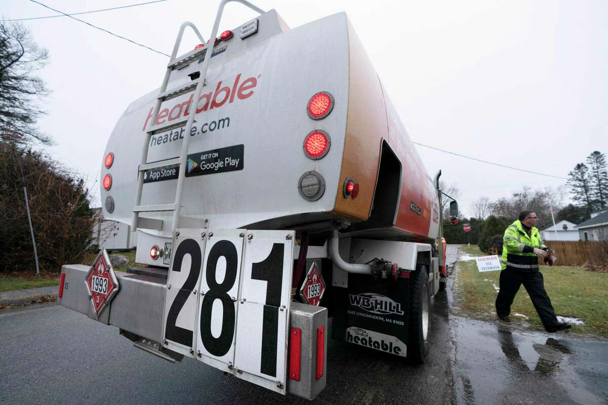 A a heating oil truck indicates a price of $2.81 a gallon, Thursday, Dec. 16, 2021, in Lewiston, Maine. With costs rising and federal pandemic assistance ending, Republicans in Connecticut are calling on Gov. Ned Lamont to use state surplus funds to plug the shortfall.