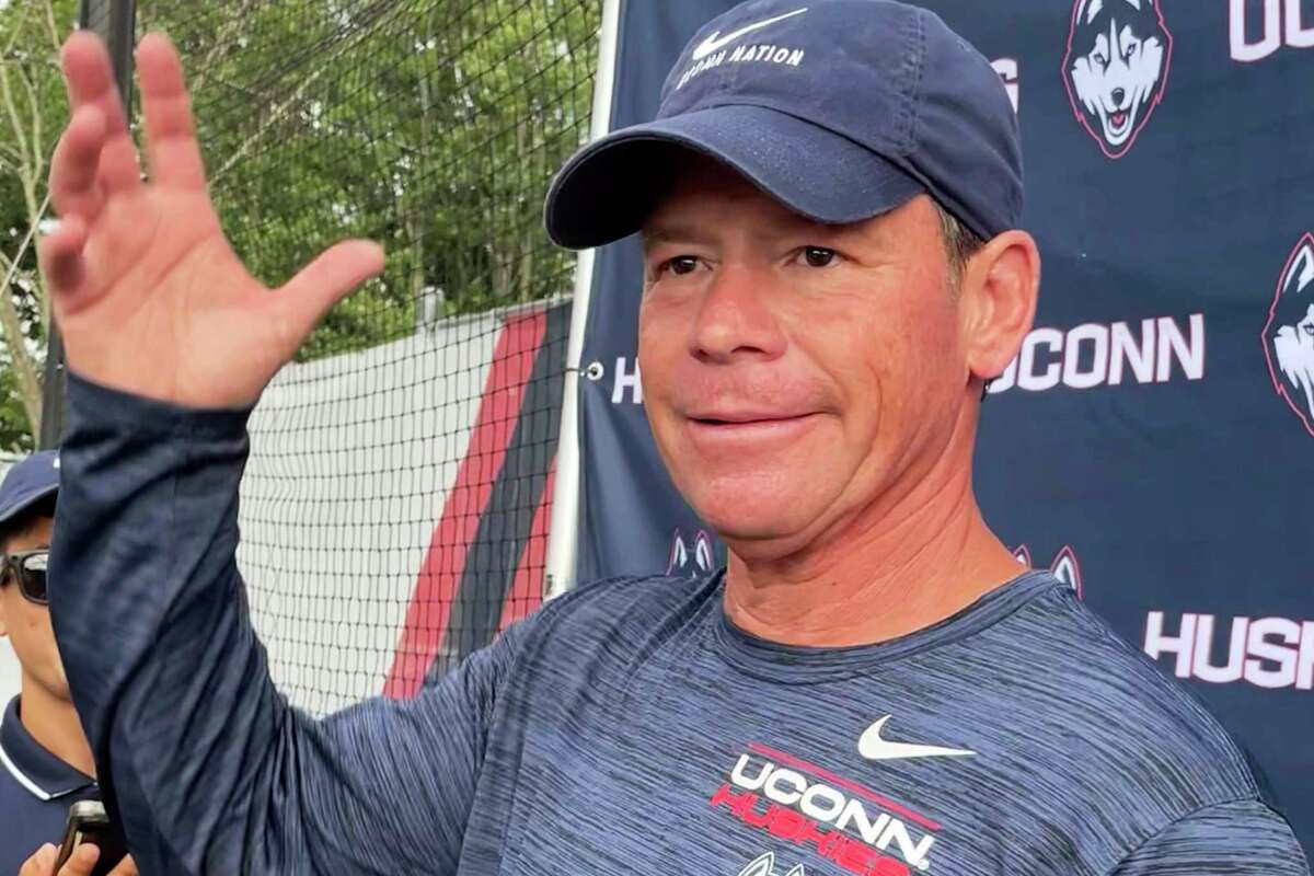 Connecticut head football coach Jim Mora speaks to reporters during the opening day of NCAA college football training camp on July 29, 2022, in Storrs, Conn.