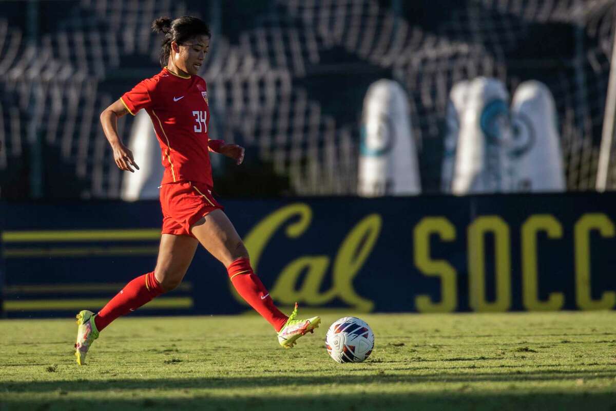 Short Pants and Long Sleeves: China's Soccer Team Plays Under