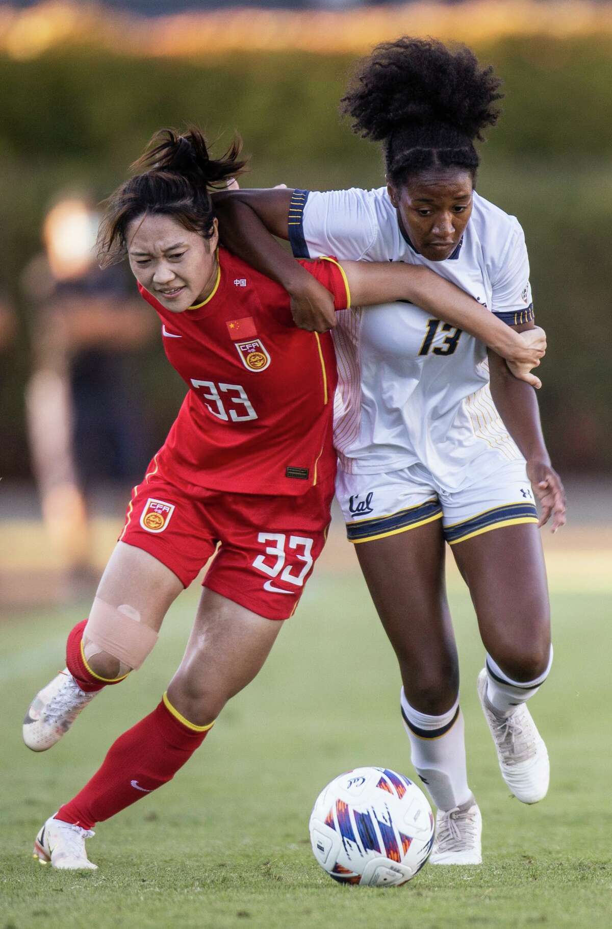 Short Pants and Long Sleeves: China's Soccer Team Plays Under