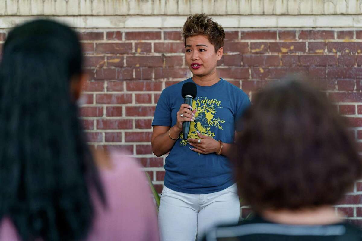 Jennifer Tran speaks at a vigil for slain 60-year-old Lili Xu in Oakland.