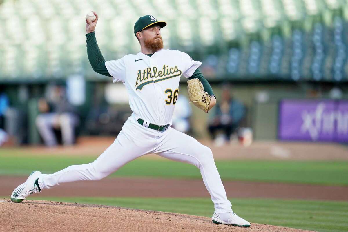 Oakland Athletics' Adam Oller pitches against the Miami Marlins during the first inning of a baseball game in Oakland, Calif., Monday, Aug. 22, 2022. (AP Photo/Godofredo A. Vásquez)