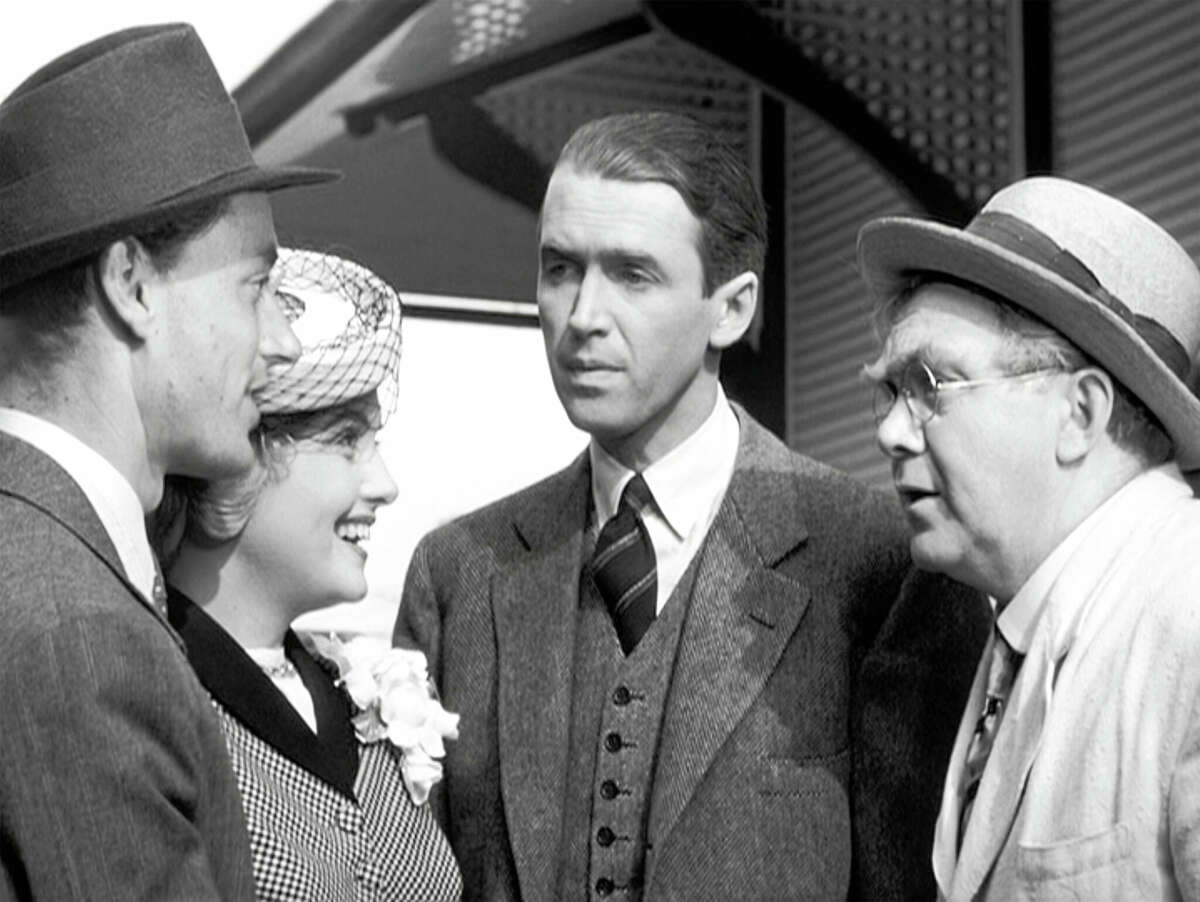LOS ANGELES - DECEMBER 20: The movie "It's a Wonderful Life", produced and directed by Frank Capra. Seen here from left, Todd Karns as Harry Bailey, Virginia Patton as Ruth Dakin Bailey, James Stewart as George Bailey and Thomas Mitchell as Uncle Billy Bailey. Premiered December 20, 1946; theatrical wide release January 7, 1947. Screen capture. Paramount Pictures. (Photo by CBS via Getty Images)