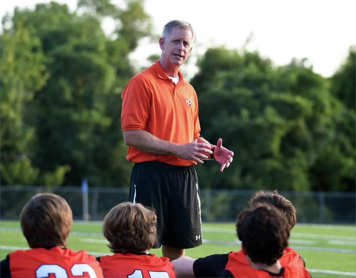 Edwardsville coach Mark Heiderscheid talks at halftime during a game against Springfield in the Metro Cup in Columbia.