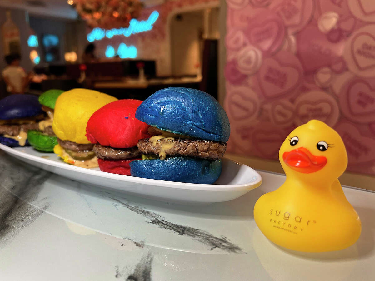 Rainbow Sliders include five mini cheeseburgers on vividly colored buns along with a free rubber duck at Sugar Factory American Brasserie at The Shops at Rivercenter on the San Antonio River Walk. 