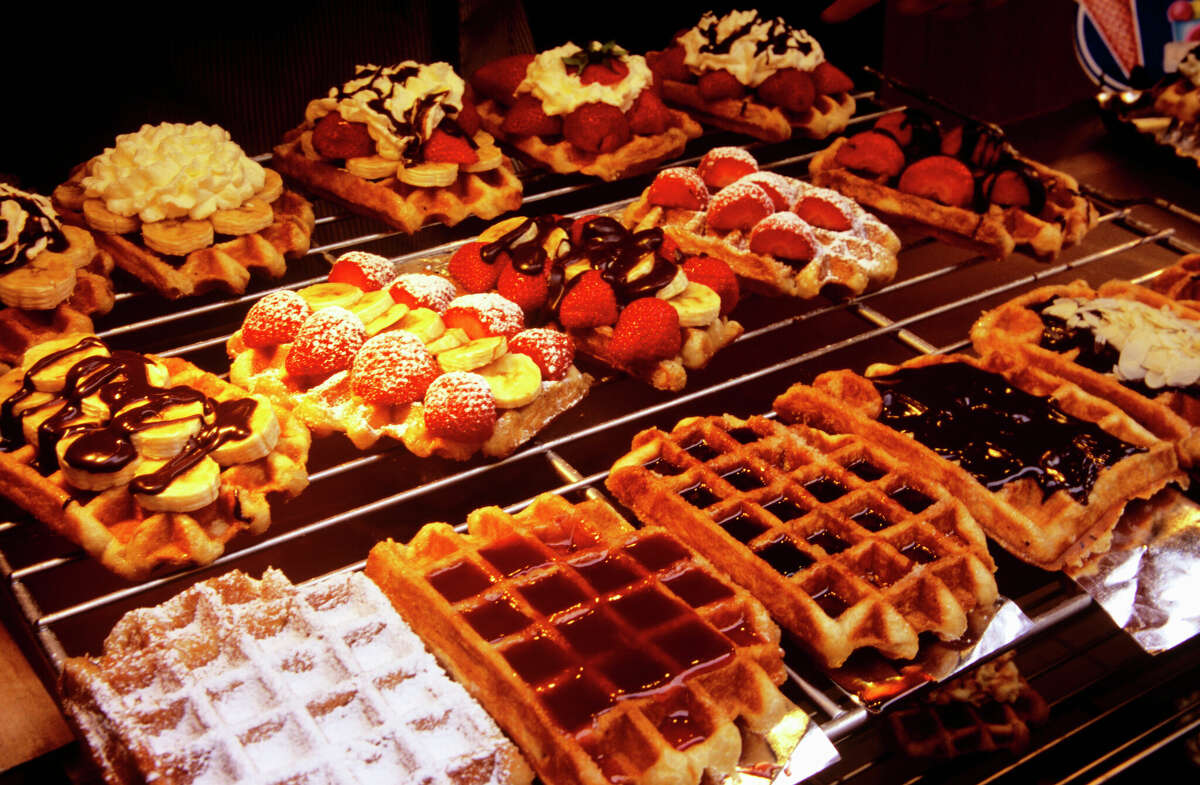 Belgian waffles topped with fruit are one of the most popular snacks on the streets of Brussels, Belgium.