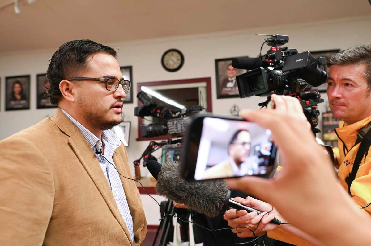 Adam Martínez, father of a child who was in Robb Elementary school but was able to get out safely, speaks to the press after a meeting of the Uvalde school board on Monday.