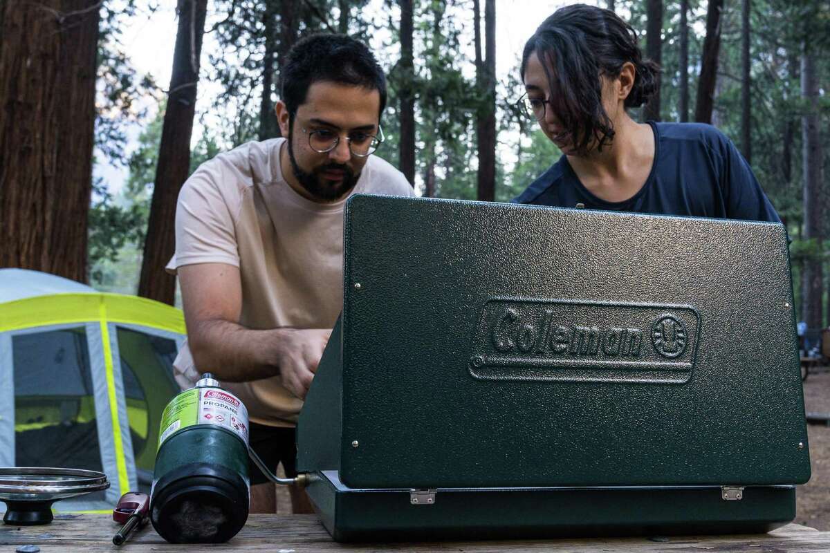 Propane stoves are used almost universally by campers for cooking, lighting and heating. Here, Ibrahim Ozaslan and Kubra Keskin use one to prepare coffee and breakfast at their Yosemite campsite.
