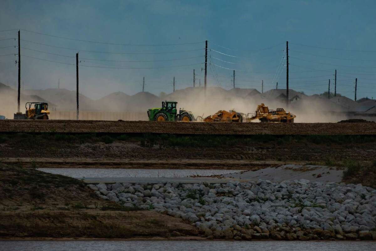 Construction on new developments north of Interstate 10 and west of the Grand Parkway continues on what used to be prairie land, Thursday, July 7, 2022, in Katy.