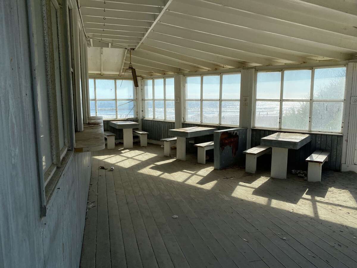 Windows inside the Siren Canteen frame the Pacific Ocean.