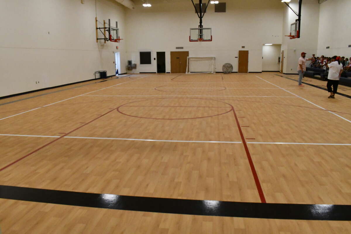 Across from the cafeteria is the brand new gym for the kids to use during gym classes and staff can use for other needs. 