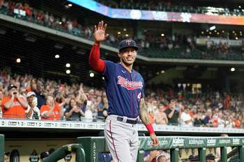 Minnesota Twins' Carlos Correa and Daniella Correa await the