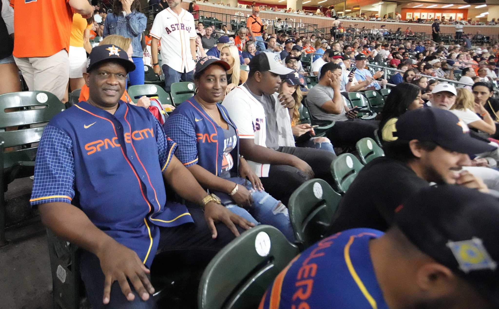 The Texas Rangers banned a fan after a Hispanic family says he harassed  them at a game