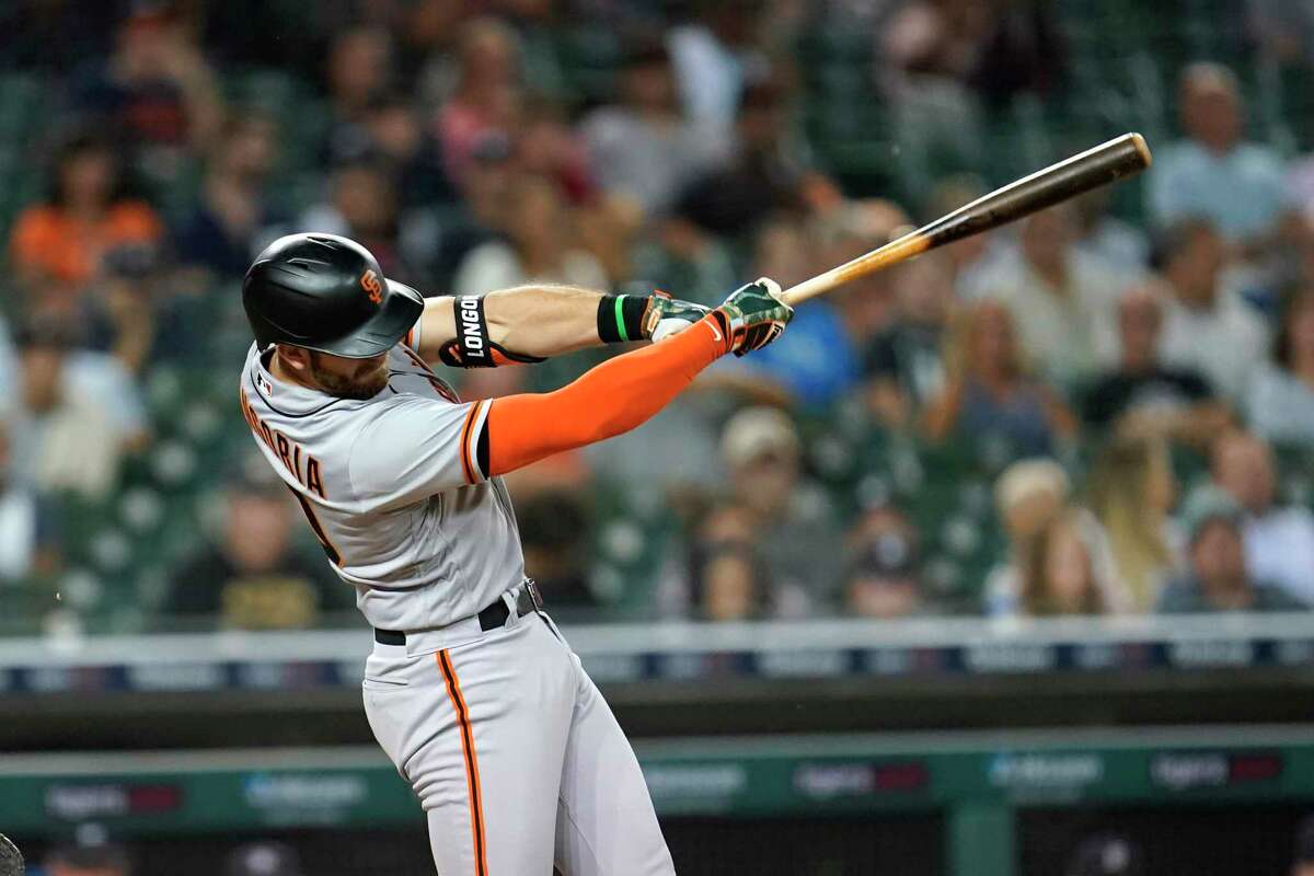 San Francisco Giants' Evan Longoria hits a two-run home run against the Detroit Tigers in the sixth inning of a baseball game in Detroit, Tuesday, Aug. 23, 2022. (AP Photo/Paul Sancya)