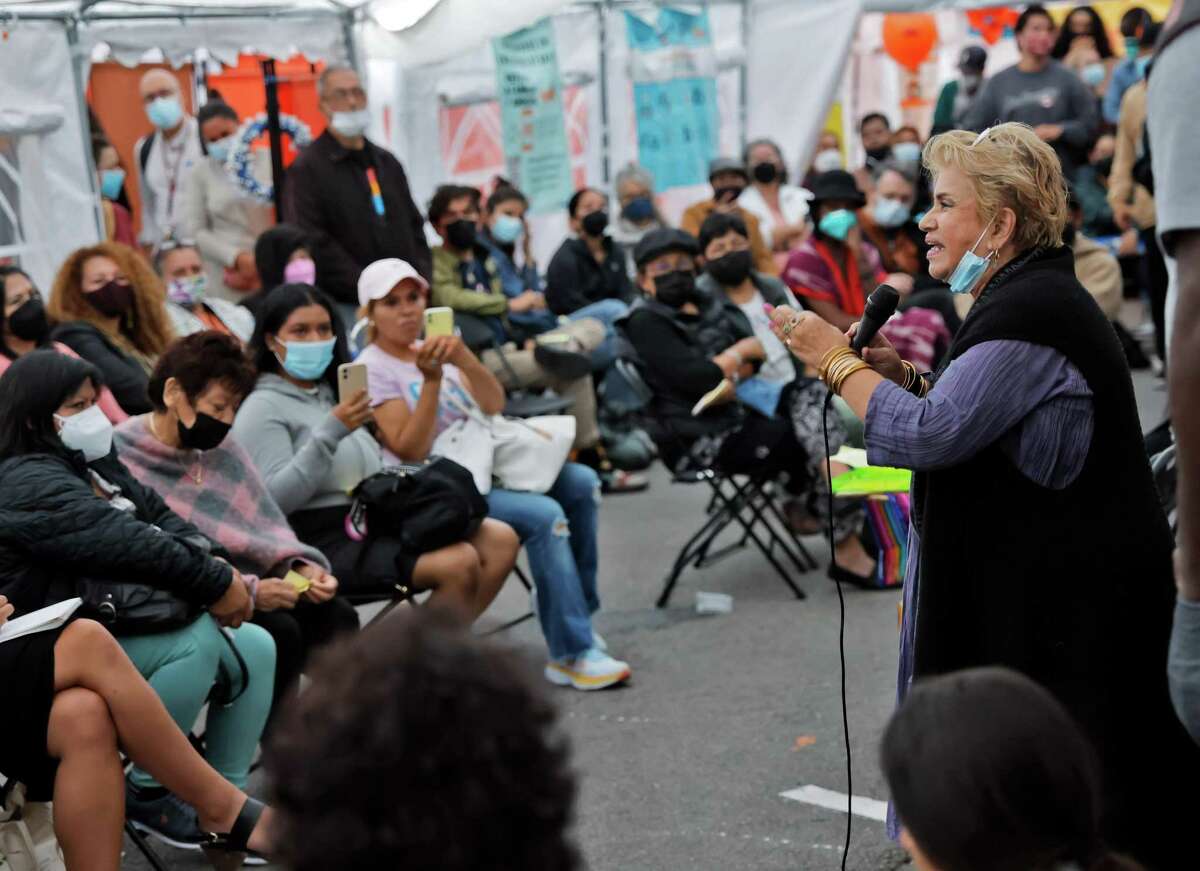 Maria Cristina Gutierrez implores audience members to try to work together for a solution during a townhall meeting with 21 community agencies and Mission residents discussing the fence that was erected at 24th and Mission BART in San Francisco, Calif., on Tuesday, August 23, 2022.After activists took down the fences twice, officials are confused about how to proceed.