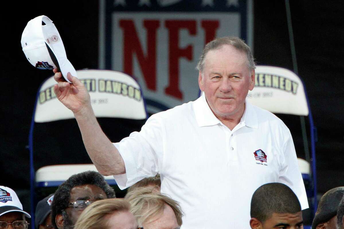 FILE - In this Aug. 4, 2012 file photo, Pro Football Hall of Fame member Len Dawson is introduced during the induction ceremony at the Pro Football Hall of Fame in Canton, Ohio. Dawson, who helped the Kansas City Chiefs to a Super Bowl title, died Wednesday, Aug. 24, 2022. He was 87.