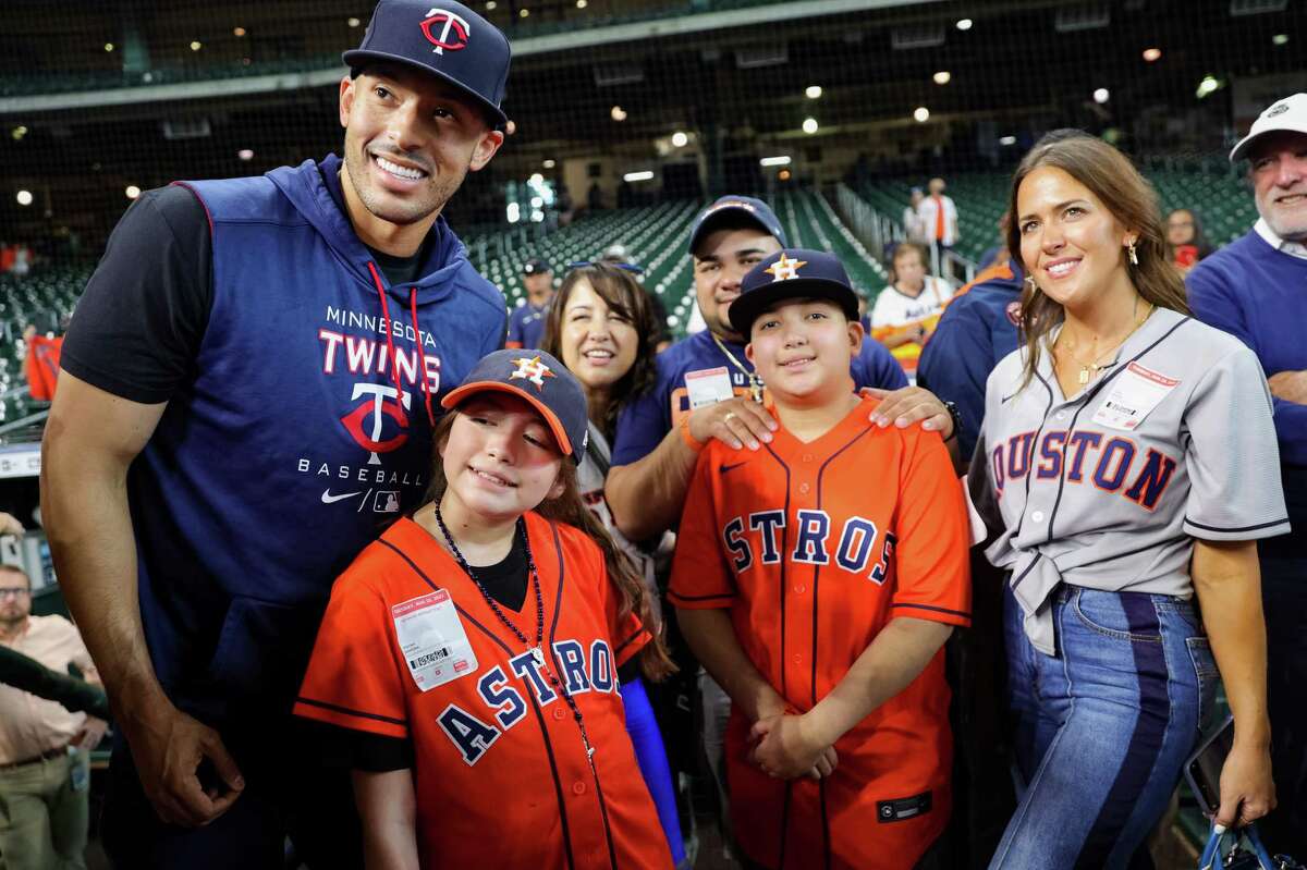 Carlos Correa of the Minnesota Twins stands alongside Mayah Nicole Zamora, and the Zamora family. Mayah is a survivor of the school shooting at Robb Elementary in Uvalde. Photos taken prior to a game between the Houston Astros and the Minnesota Twins at Minute Maid Park on August 23, 2022 in Houston.