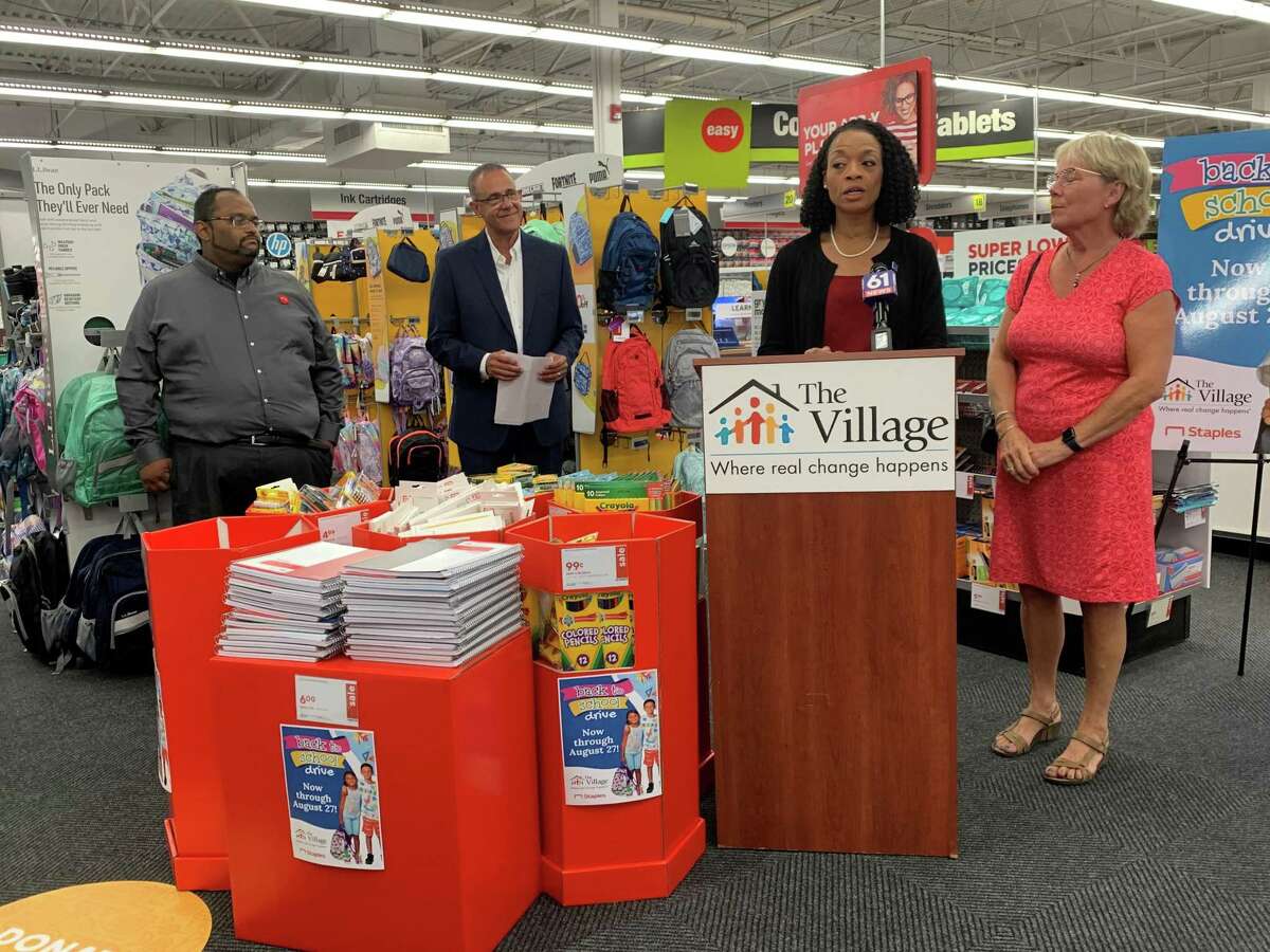 Lorna Thomas-Farquharson, the chair of West Hartford’s Board of Education, speaks at Staples on Monday. Thomas-Farquharson is surrounded by (from left) Adnan Hoque, manager of the West Hartford store, Galo Rodriguez, president of the Village for Families and Children, and West Hartford Board of Education member Clare Neseralla.