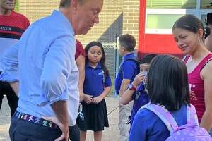 Lamont greets students on first day as school COVID concerns fade