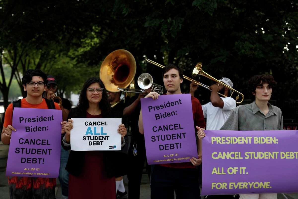 Rep. Rashida Tlaib (R-MI) (second from left) attends a rally outside of the White House to call on U.S. President Joe Biden to cancel student debt on July 27, 2022 in Washington, D.C.