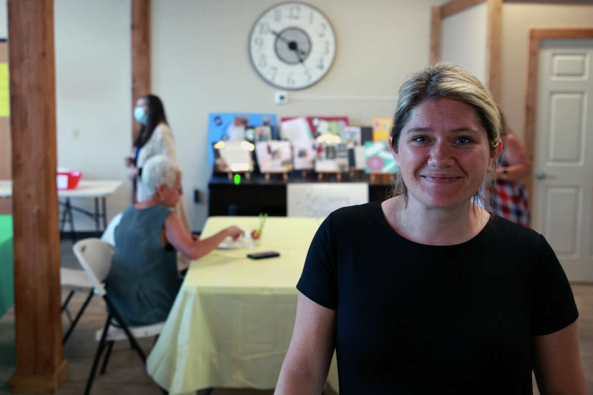 Cassandra Kamaloski, executive director of the Manistee Friendship Society poses for a picture Tuesday during an open house celebrating the society's 20th anniversary. 