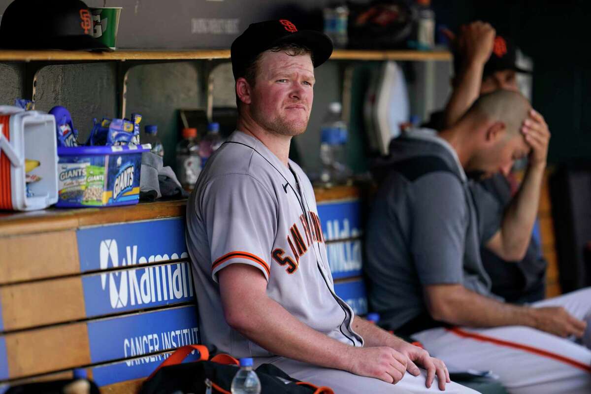 San Francisco Giants pitcher Logan Webb sits in the dugout after being pulled against the Detroit Tigers in the fifth inning of a baseball game in Detroit, Wednesday, Aug. 24, 2022. (AP Photo/Paul Sancya)