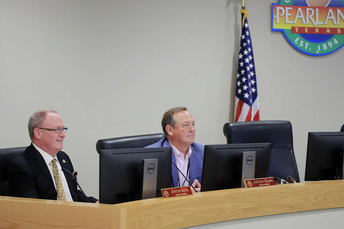 Pearland City Council member Joseph Koza, shown with fellow council member Jeff Barry in a June photo, says that a proposal for new city fees gives him "heartburn,"  especially in light of expected increases to water and wastewater rates. 