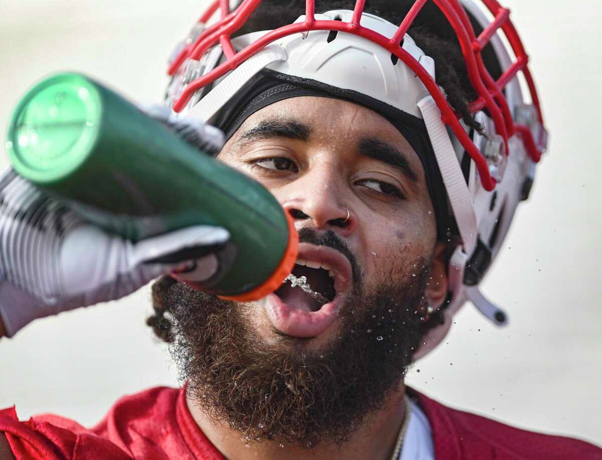 Linebacker Isaiah Paul cools hydrates himself during University of the Incarnate Word football practice on Thursday, Aug. 4, 2022.