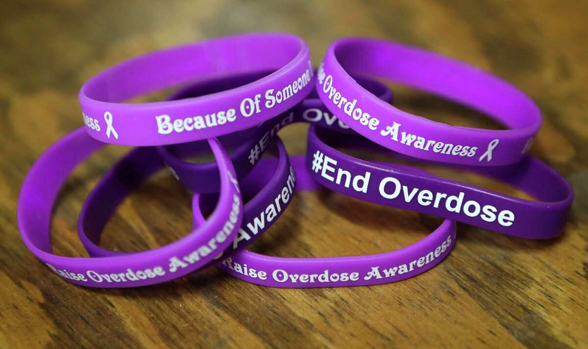 Purple wrist bands in support of ending drug overdoses are seen, Wednesday, Aug. 24, 2022, in Conroe.