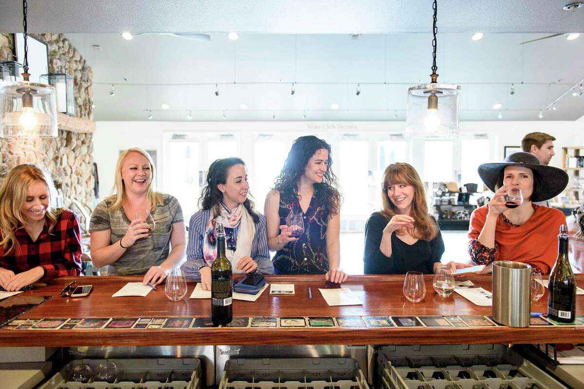 Amanda Fier (from left), Laura Burrus, Jenna Smith, Jessica Smith, Libby James and Whitney Kirk sip wine at the bar in the tasting room at Imagery Estate Winery, which encourages walk-ins.