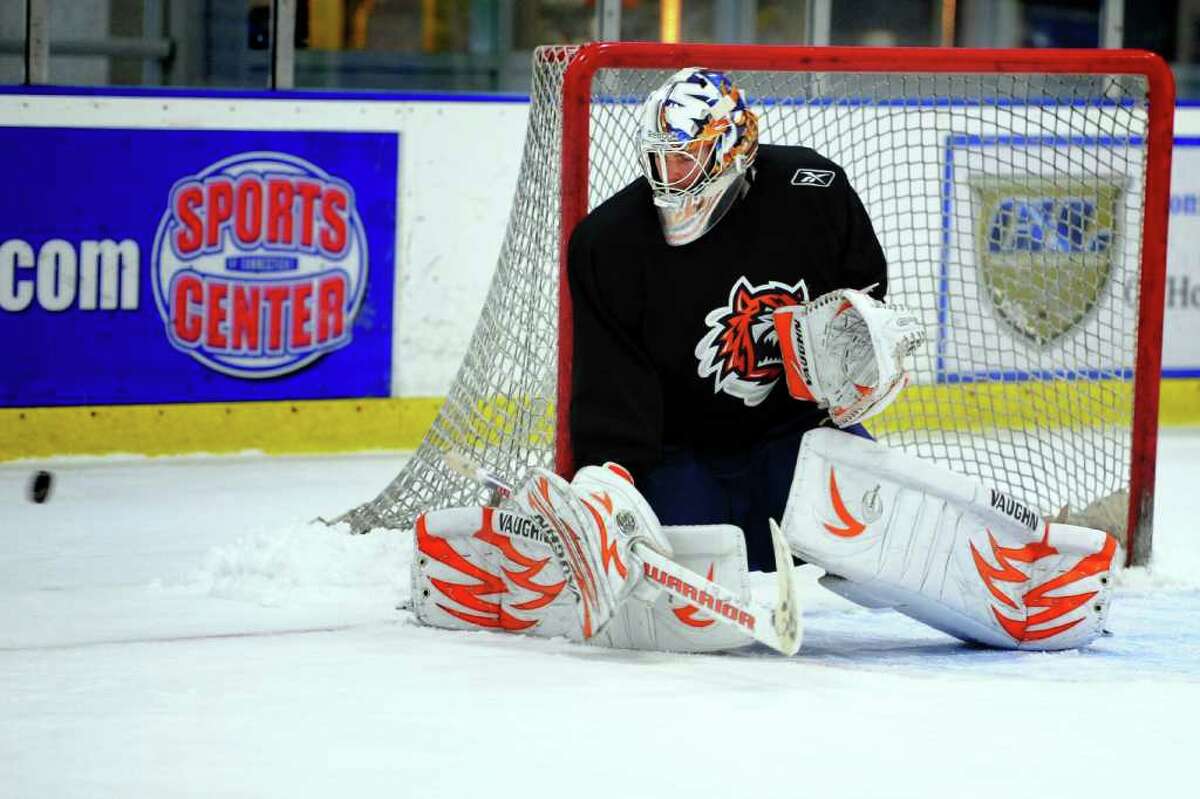 Goaltender Mikko Koskinen deflects a shot during Sound Tigers practice Wednesday Oct. 6, 2010 at The Rinks at SportsCenter of Connecticut in Shelton.