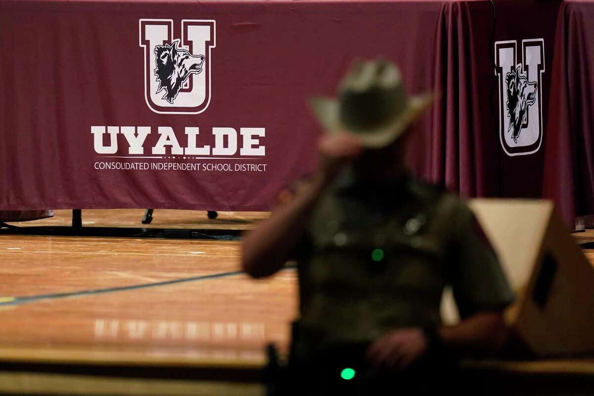 Texas Department of Safety Troopers stand by for a meeting of the Board of Trustees of Uvalde Consolidated Independent School District, Wednesday, Aug. 24, 2022, in Uvalde, Texas. The board is expected to hold termination hearings to decide the employment fate of Uvalde School District Police Chief Pete Arredondo.