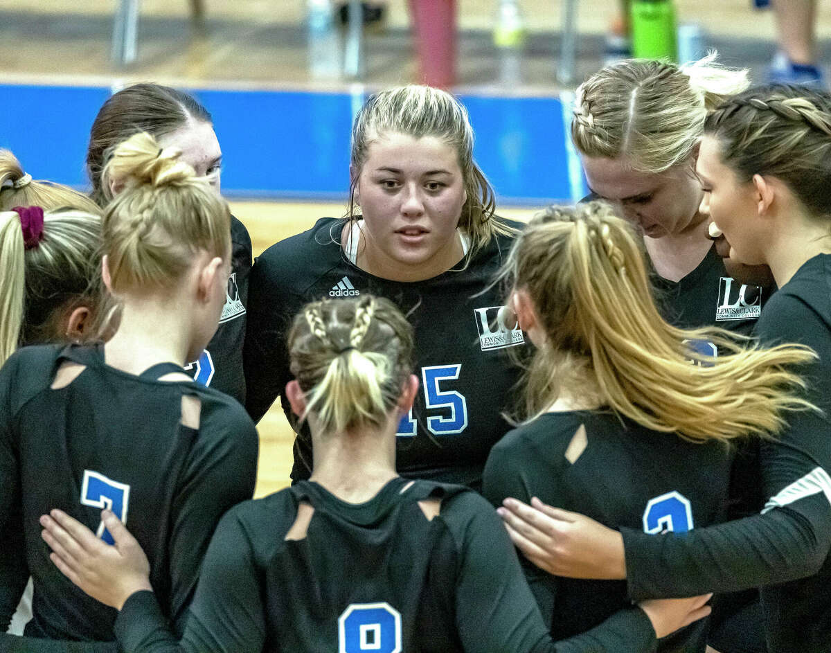 The Lewis and Clark Trailblazers volleyball team huddles during a break in Wednesday's season opener against Kaskaskia at the River Bend Arena. In the center is LCCC's Jacey Trask (15).