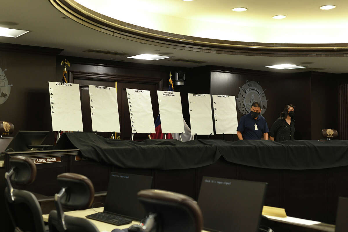 Candidates gathered alongside friends, family and supporters at the city hall council chambers for a drawing of their ballot placement on Wednesday evening on August 24, 2022.
