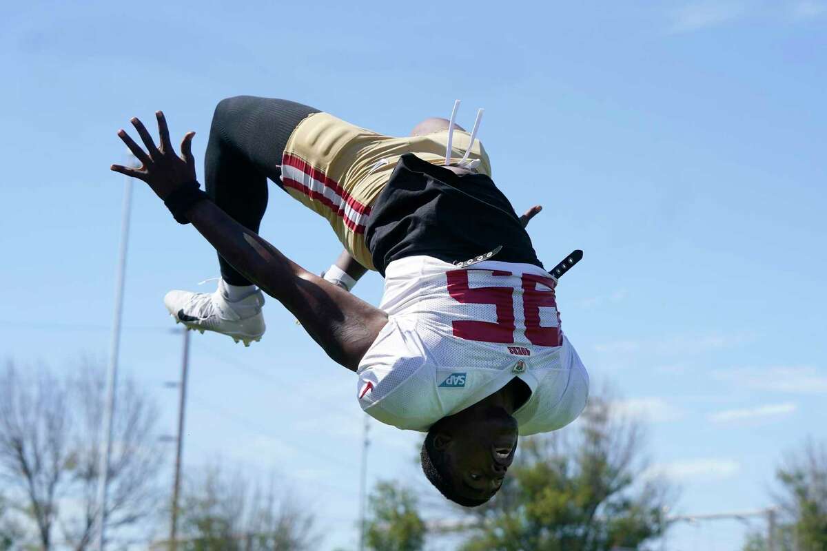 San Francisco 49ers defensive lineman Drake Jackson does a back flip in front of fans before taking part in drills at the NFL football team's practice facility in Santa Clara, Calif., Friday, Aug. 5, 2022. (AP Photo/Jeff Chiu)