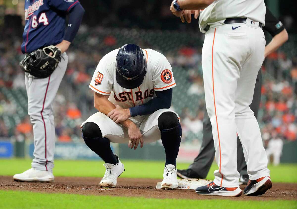 Astros outfielder Chas McCormick was in visible pain after dislocating the pinky finger on his right hand during Wednesday's game.
