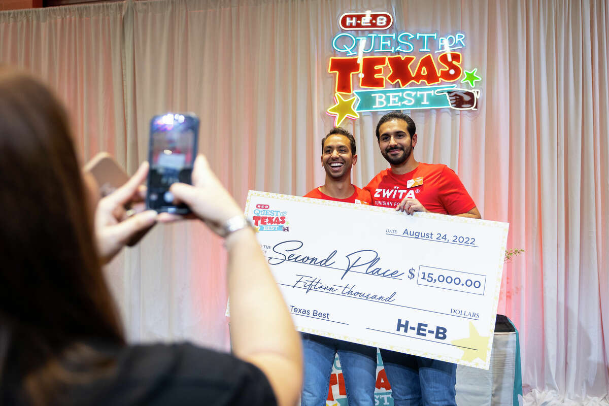 Karim and Mansour Arem pose with their $15,000 check for placing second in H-E-B's 2022 Quest for Texas Best.