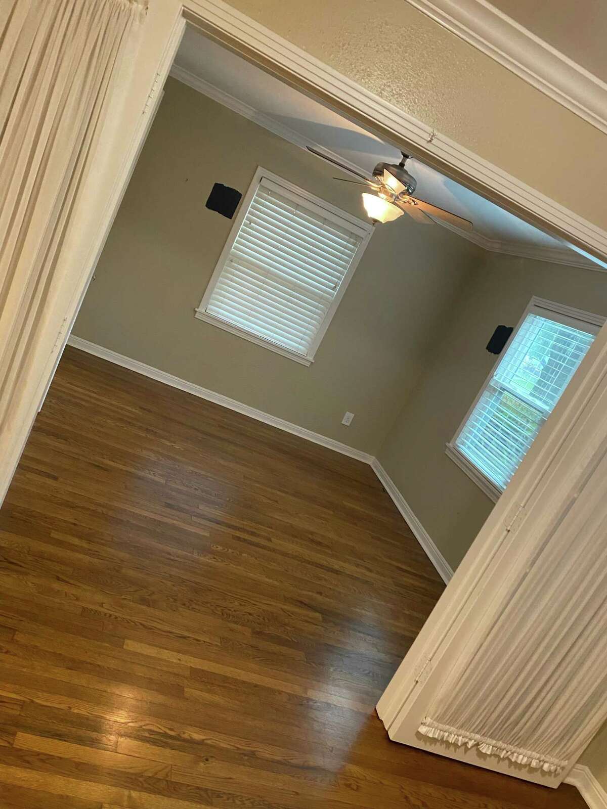 This before photo shows the empty bedroom that was turned into a dining room. The interior wall and doors were removed to open it to the rest of the house.