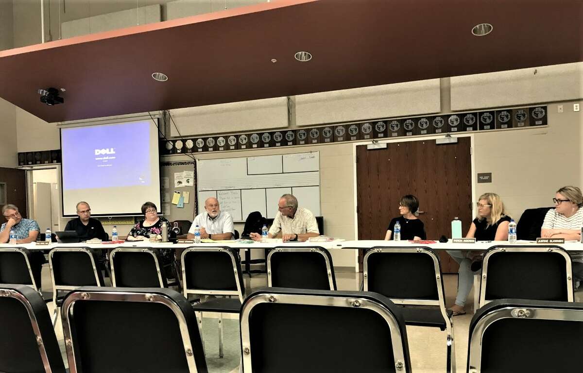 The Manistee Area Public Schools Board of Education and superintendent Ron Stoneman discuss plans to retire the district's Chippewa mascot Wednesday during a work study session.