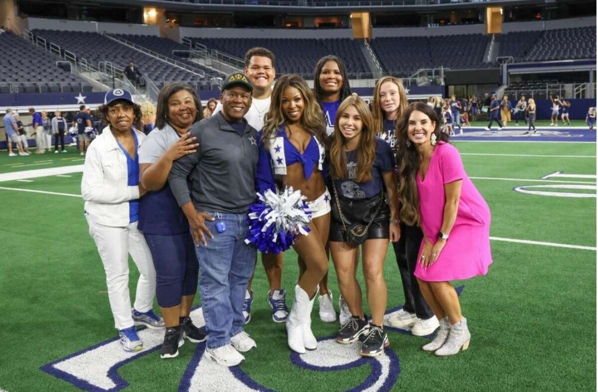 New Dallas Cowboys Cheerleader Kayla Hayes, 22, of Florissant, Missouri, surrounded by family and friends, including mentor, instructor and founder of DK Dance Productions Darci Kay Ward, far right, of Jerseyville, Aug. 22 at AT&T Stadium in Dallas for the Cowboys' "Meet the Team" event. Ward, born and raised in Jerseyville, choreographed a brand new solo routine that Hayes performed during the Cowboys' cheer team's audition process.