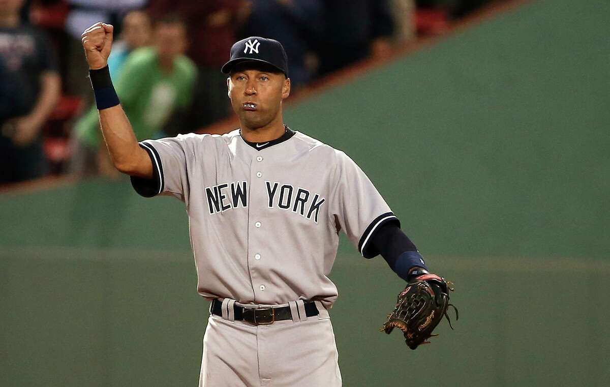 New York Yankees shortstop Derek Jeter pumps his fist after the final out in the Yankees' 6-4 win over the Boston Red Sox in 2014.