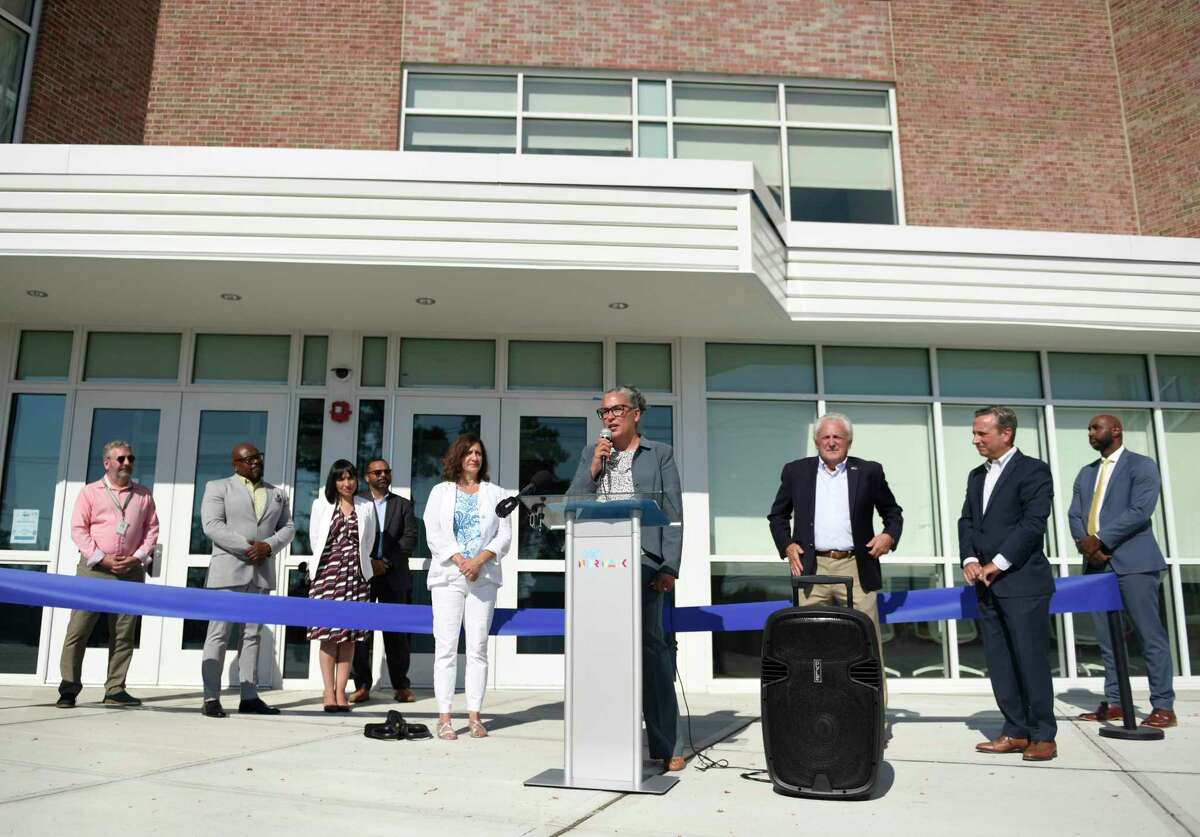 Norwalk Superintendent of Schools Alexandra Estrella speaks at the newly refurbished Jefferson School in Norwalk, Conn. Thursday, Aug. 25, 2022. Local officials gathered to cut a ribbon and tour the school, which was closed for years for renovations.