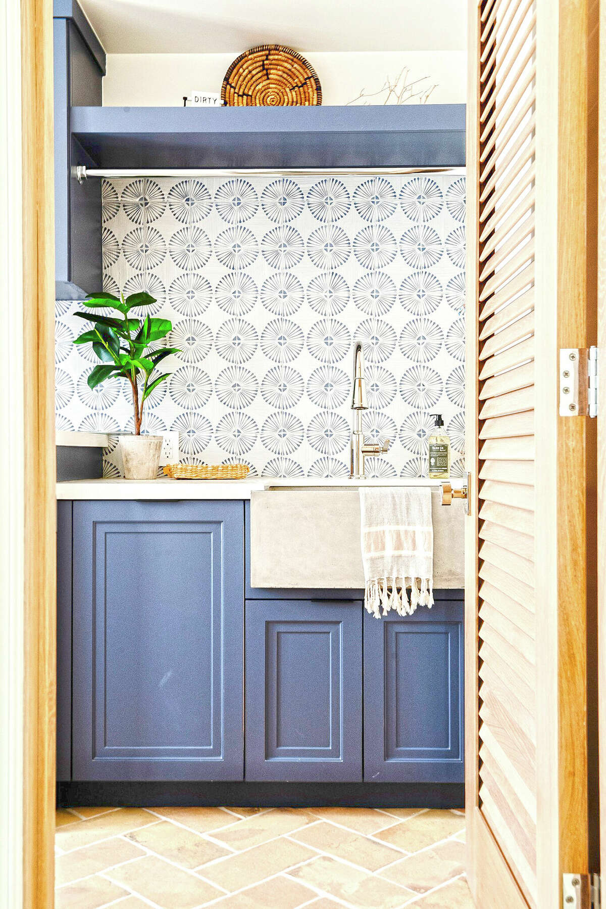 Laundry rooms no longer need to be hidden. Hillary Stamm of HMS Interior Design says, "This is a space you aren't in for hours (let's hope!) so have some fun. A textured tile or an intricate design with a splash of color can work wonders here."