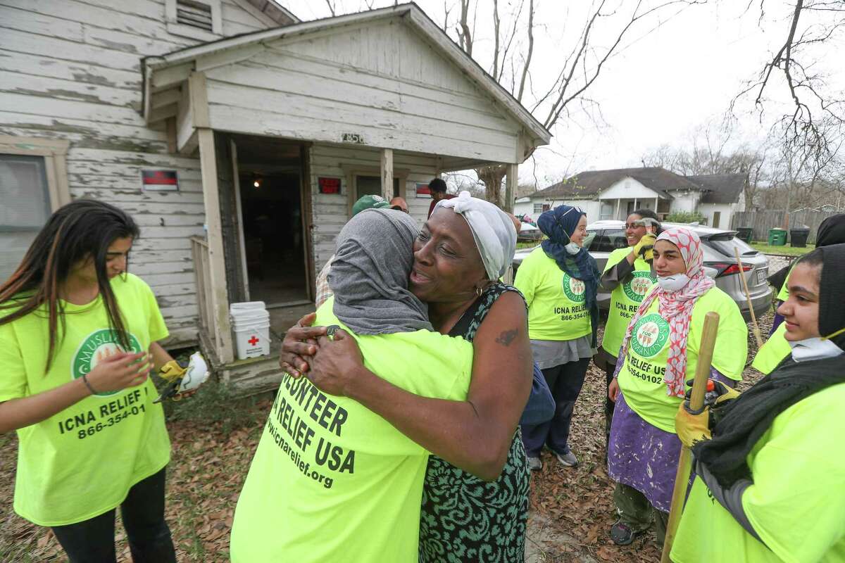 Alfredia Brooks asked to hug each of the volunteers from ICNA Relief USA and Qalam Institute, Houston and Dallas, who gutted out her Hurricane Harvey flooded home Saturday, Feb. 24, 2018, in Houston.