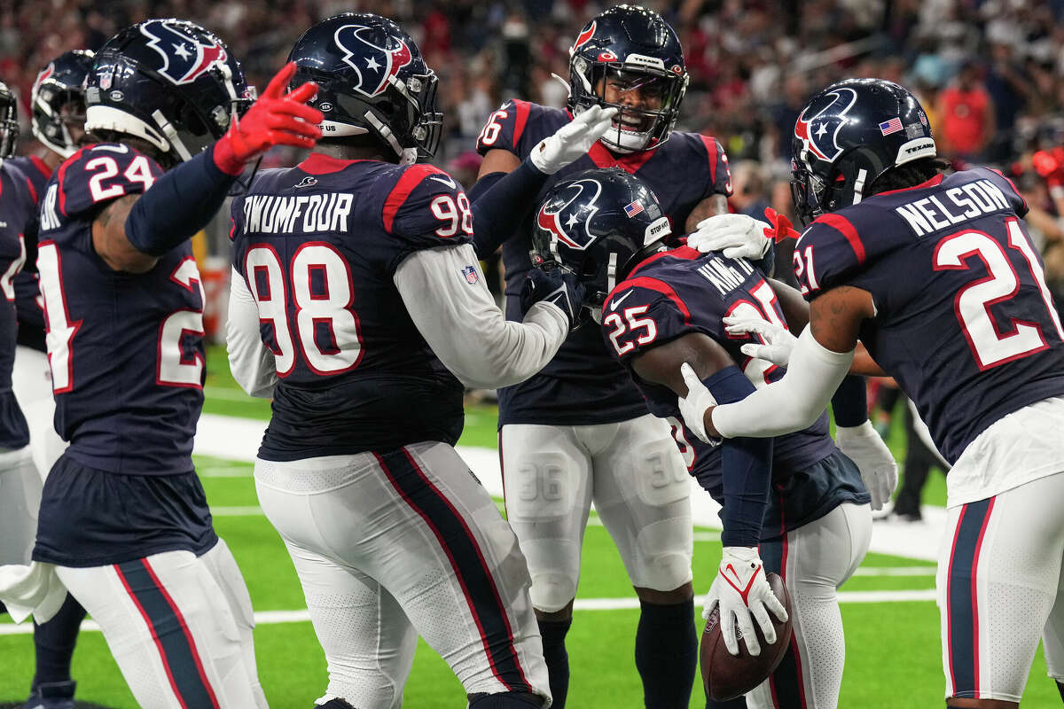 Houston Texans cornerback Desmond King II (25) celebrates with his teammates after intercepting a pass by San Francisco 49ers quarterback Nate Sudfeld during the first half of an NFL football game Thursday, Aug. 25, 2022, in Houston.