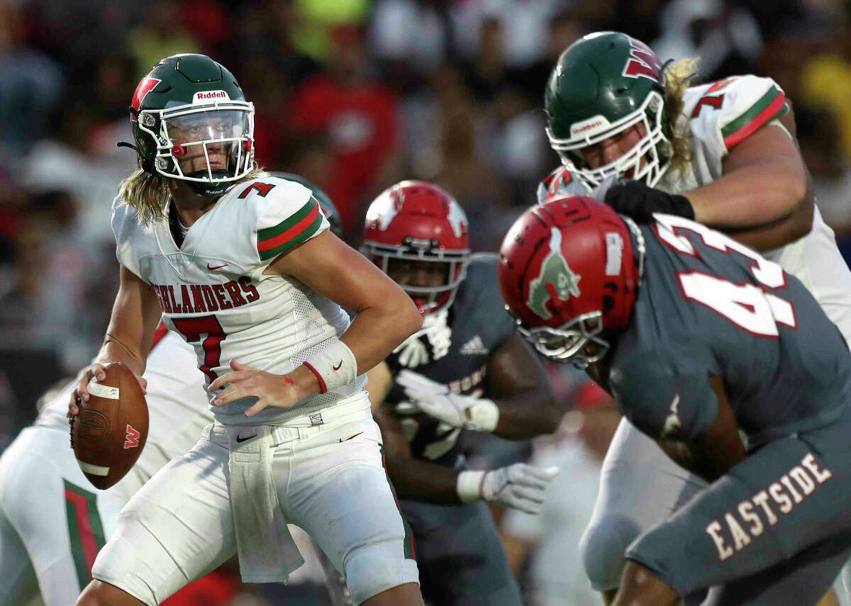 The Woodlands quarterback Mabrey Mettauer (7) looks to pass under pressure during the second quarter of a non-district high school football game at Galena Park ISD Stadium, Thursday, Aug. 25, 2022, in Houston.