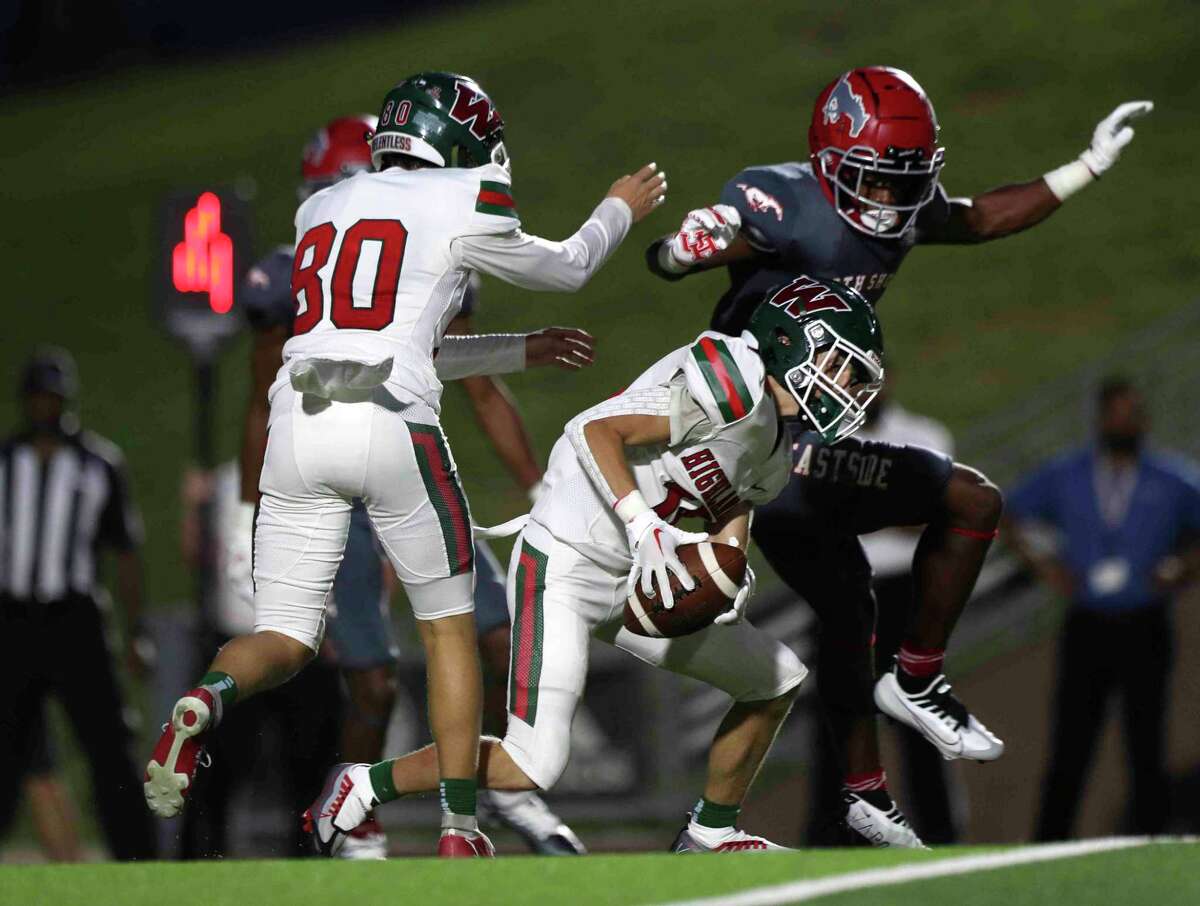 The Woodlands defensive back Owen Acuff (19) scrambles after fumbling a field goal attempt during the second quarter of a non-district high school football game at Galena Park ISD Stadium, Thursday, Aug. 25, 2022, in Houston.